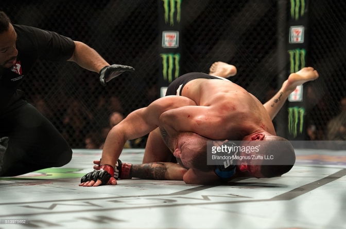 Nate Diaz sinks in the rear-naked choke against Conor McGregor (Credit Getty Images)